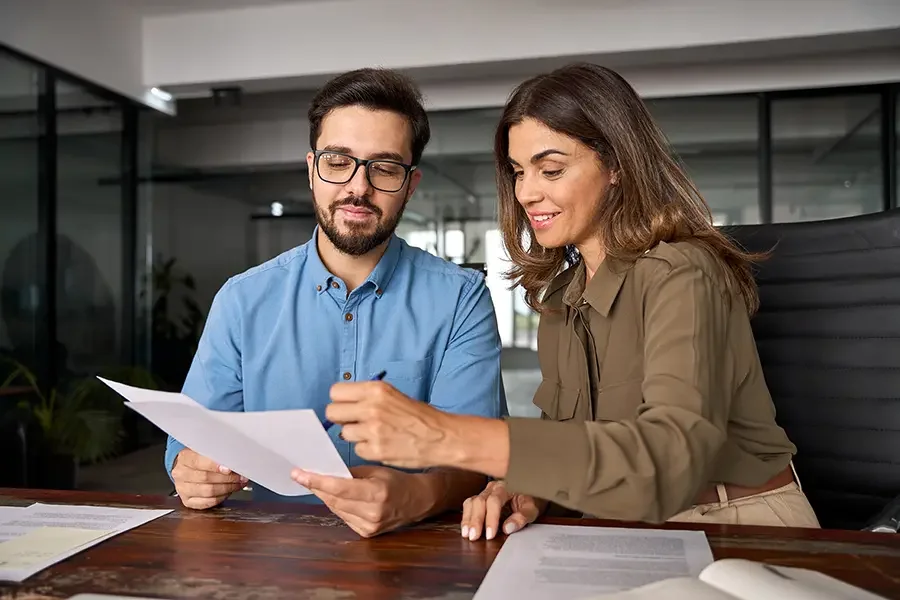 A man and woman going over paper